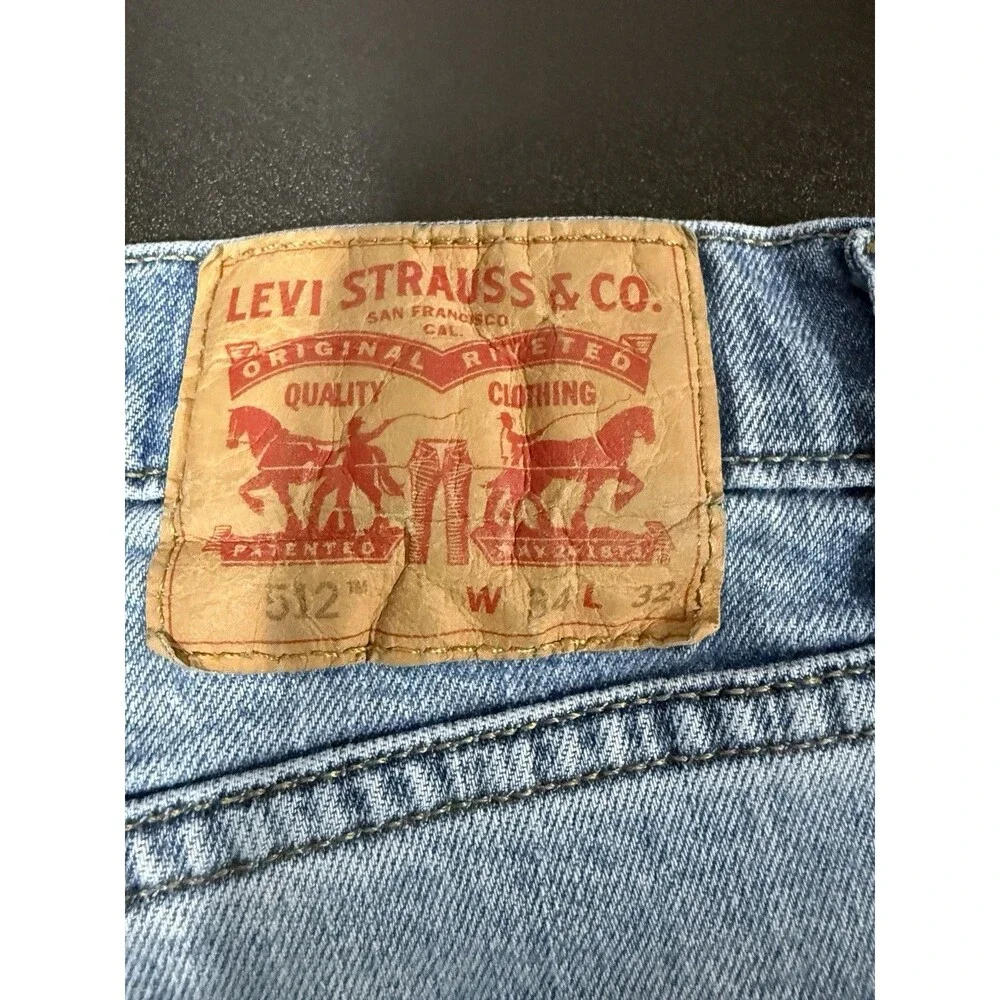 Levi's Men's Blue Light Wash Denim Jeans Slim Tapered Low Rise 5-Pocket